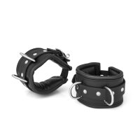 BDSM handcuffs made of black leather, padded, adjustable...