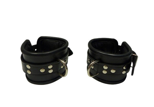 BDSM handcuffs made of black leather, padded, adjustable in size