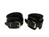 BDSM handcuffs made of black leather, padded, adjustable in size